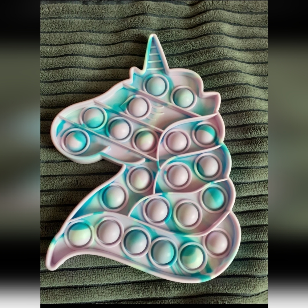 A tiedye unicorn fight toy